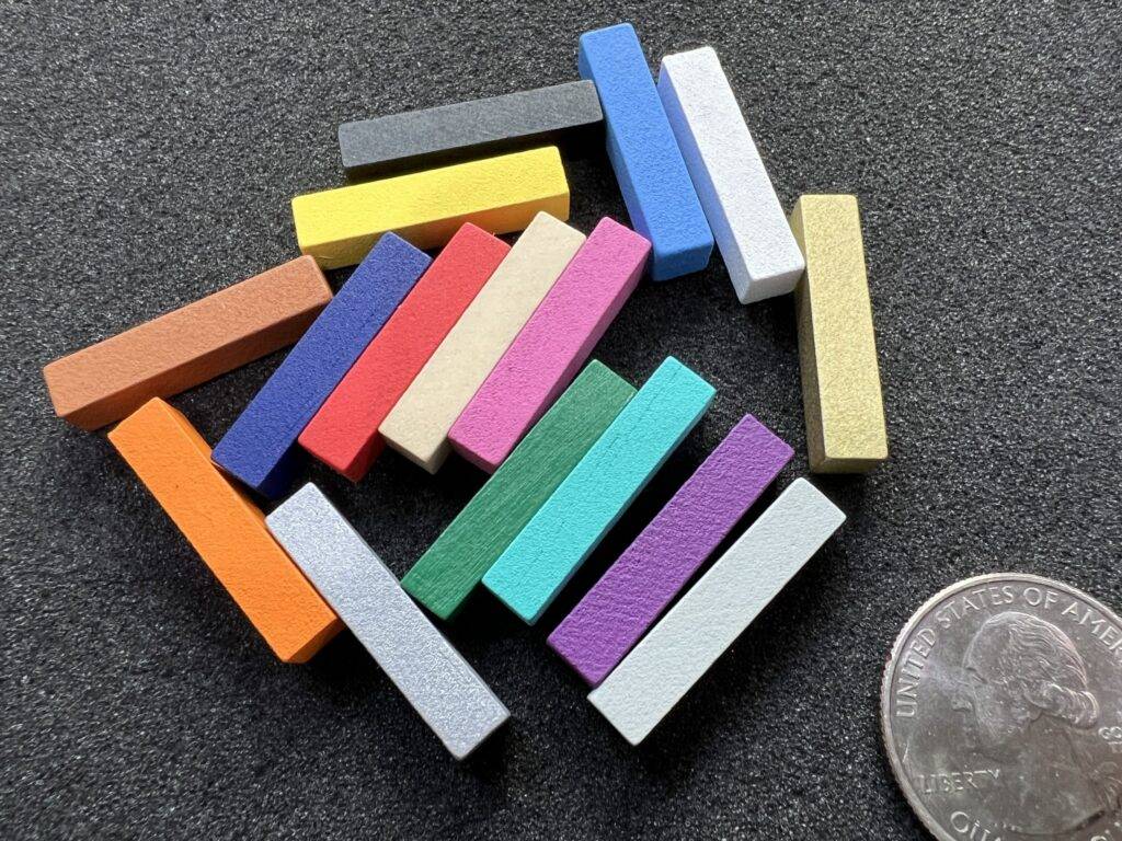 catan road pieces near a quarter