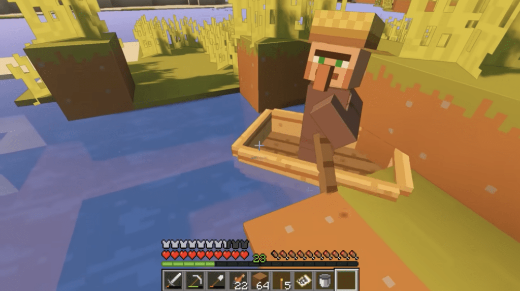 A villager in a boat at the edge of a river. 